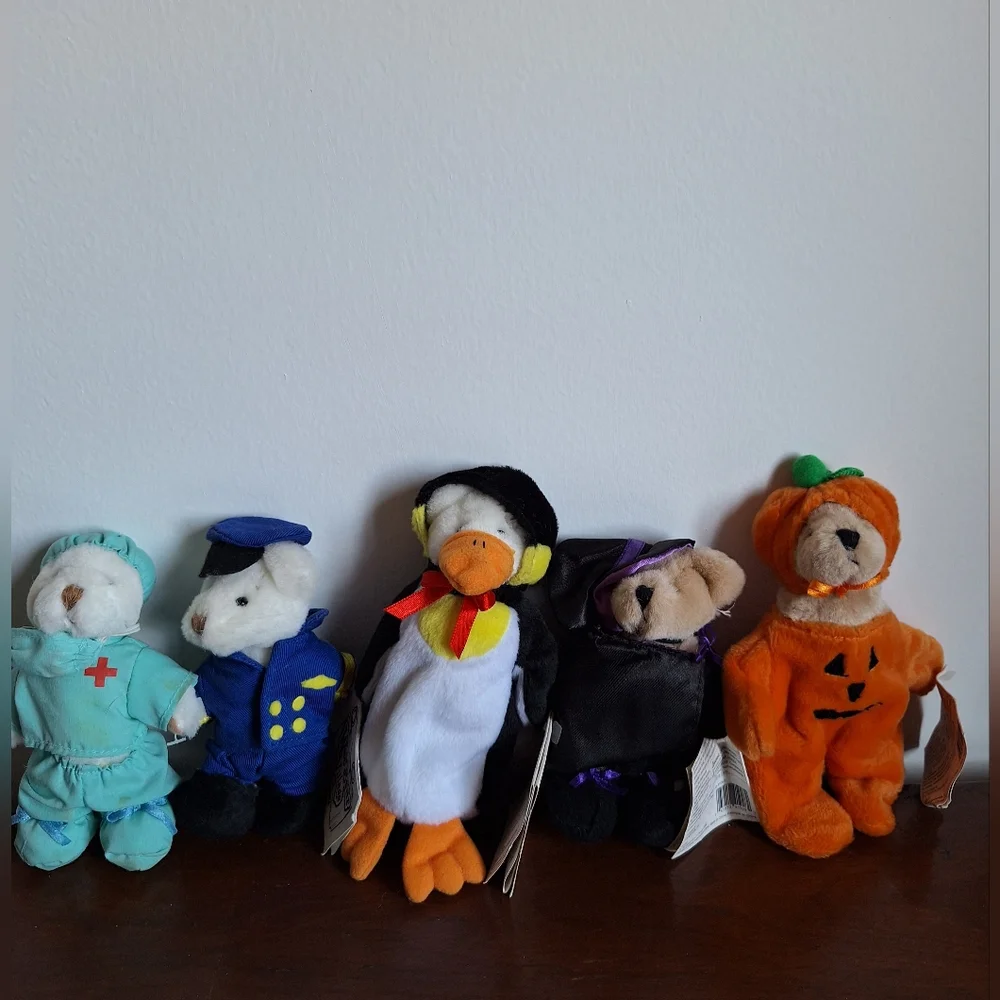 Collectible teddy bears from the Ganz brand, specifically from the Wee Bear Vill